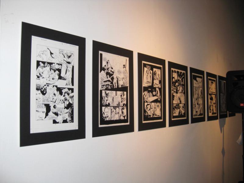 Wall of original art from the series.