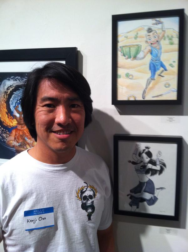 Artist Kenji Ono poses with his contributed pieces