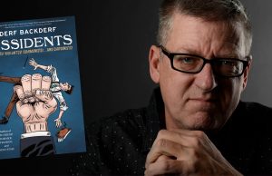 DC – The Dissidents Signing | Sept 10th A man with glasses sits in a dark room beside a floating book titled “The Dissidents: Autocrats, Voltaires, Commanders, and Commandos” by Derf Backderf.